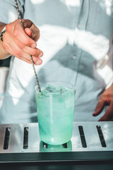 Bartender making alcoholic cocktails! Cocktail bar in summer 
