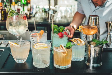 Bartender making alcoholic cocktails! Cocktail bar in summer 