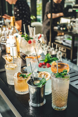 Bartender making alcoholic cocktails! Cocktail bar in summer 