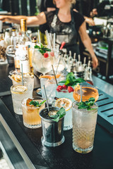 Bartender making alcoholic cocktails! Cocktail bar in summer 