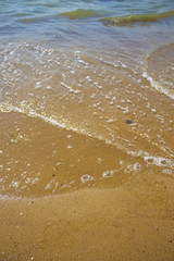 Soft wave of the sea on the sandy beach