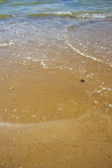 Soft wave of the sea on the sandy beach
