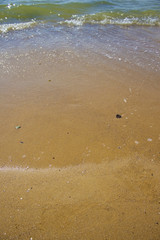 Soft wave of the sea on the sandy beach