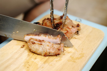 Close-up steak sliced grill pork on wooden cutting board