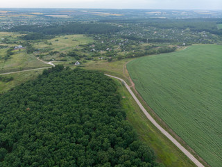 Road in the field at dusk from a bird's eye view