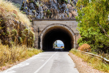 Fototapeta na wymiar Empty mountani road with tunnel in Pellegrino mount in Palermo, Sicily.