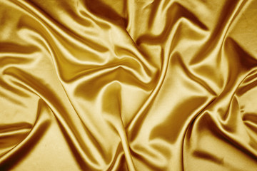 Gold luxury satin fabric texture for background