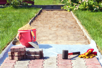 Laying of paving slabs in the garden