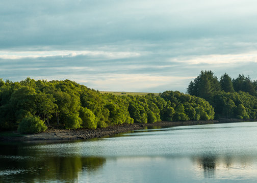 View of Fontburn Reservoir, Northumberland, England, UK, in evening light.