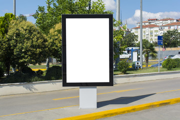Blank white mock up of vertical light box billboard at bus stop station
