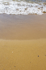 Soft wave of the sea on the sandy beach