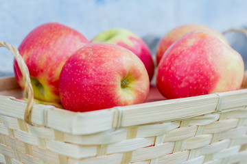 red juicy apples in a basket, fresh harvest