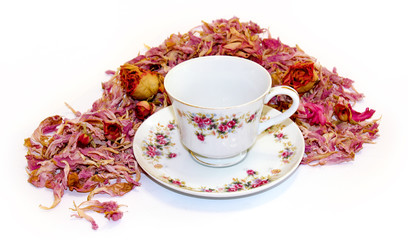 tea pair of fine porcelain among scattered petals of hydrangea and rose flowers  background