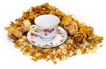 tea pair of fine porcelain among scattered petals of hydrangea and rose flowers  background