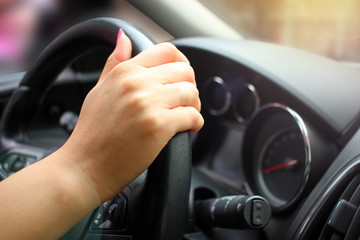 Close-up of Man Driving a Car Hand on Steering Wheel