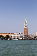 Fototapeta na wymiar The famous San Marco Campanile and the Doges Palace in front of the Grand Canal in Venice on sunny day in north Italy