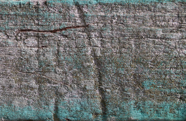 Closed up of flaking color wood plank's texture background.
