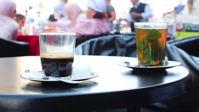 Espresso Coffee and a Mint Tea on a Cafe Table