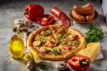 Tasty Italian pizza and its ingredients on white textured background.
