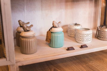 shelf with handmade jars placed to sell