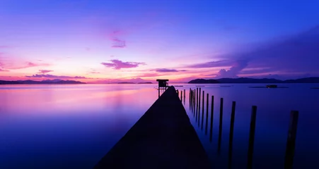 Photo sur Aluminium Mer / coucher de soleil old small jetty in to the sea in Long exposure image of dramatic sunset or sunrise,sky and clouds over tropical sea scenery landscape.