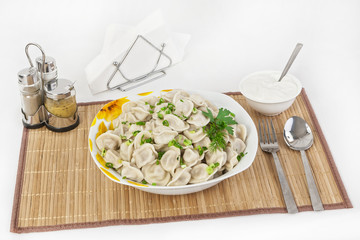 Russian dumplings with herbs and onions.