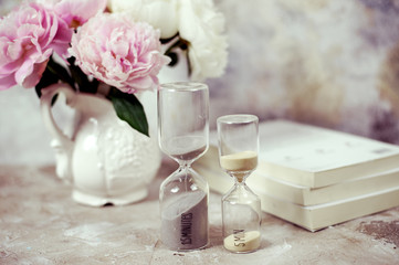 Time passing concept,urgency and running out of time. Sand fall in hourglass