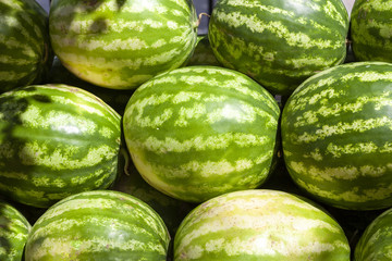 Market counter with delisios watermelons.