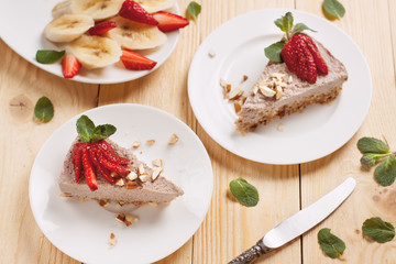 Raw vegan cheesecake with strawberry and banana