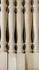 Wooden carved balusters without painting with pine texture