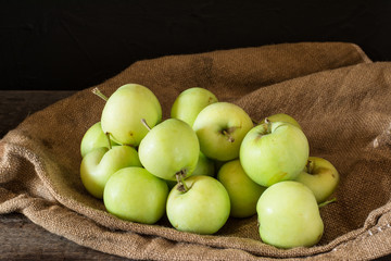 Ripe red and green apples on wooden background. Apples in bowl. Garden fruits. Autumn fruits. Autumn harvest. Yellow pears