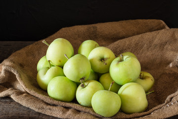 Ripe red and green apples on wooden background. Apples in bowl. Garden fruits. Autumn fruits. Autumn harvest. Yellow pears