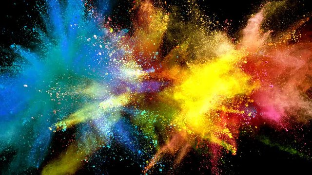 Color powder explosions isolated on black background. Shot with high speed cinema camera at 1000fps