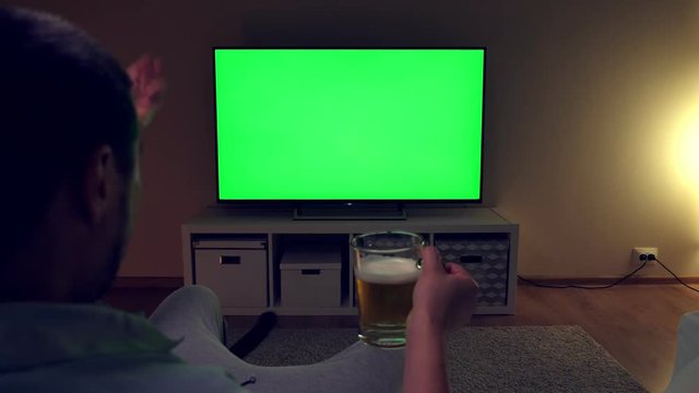 Unhappy and disappointed man watches football