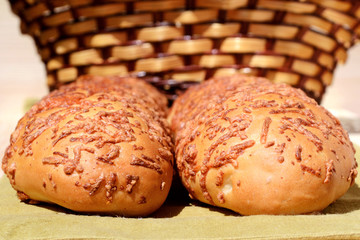 Delicious fresh rolls and basket for bread products