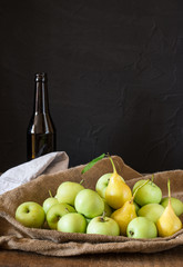 Ripe red and green apples on wooden background. Apples in bowl. Garden fruits. Autumn fruits. Autumn harvest. Yellow pears. Apple cider. Fruit vinegar. Apple vinegar.