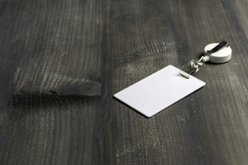 Proximity or RFID card for control security, access, protect on black wood table.