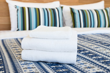 White towel fold on hotel resort bed
