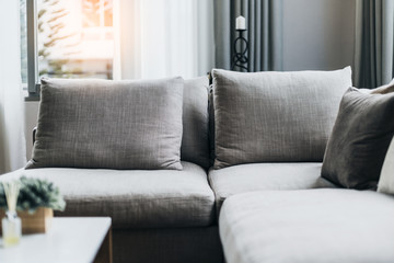 close up of natural color sofa with soft pillow interior concept