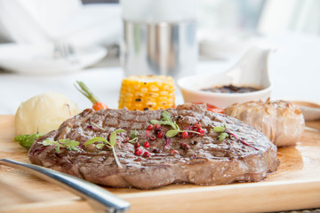  Spicy beef steak on wooden platter