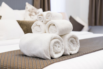 White towel roll on hotel resort bed