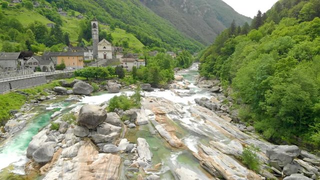 Valle Verzasca - Aerial View of clear and turquoise water stream and rocks in Verzasca River in Ticino - Verzasca Valley in Tessin, Switzerland