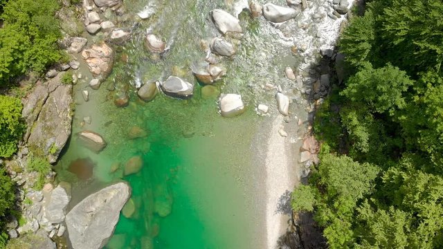 Valle Verzasca - Aerial View of clear and turquoise water stream and rocks in Verzasca River in Ticino - Verzasca Valley in Tessin, Switzerland