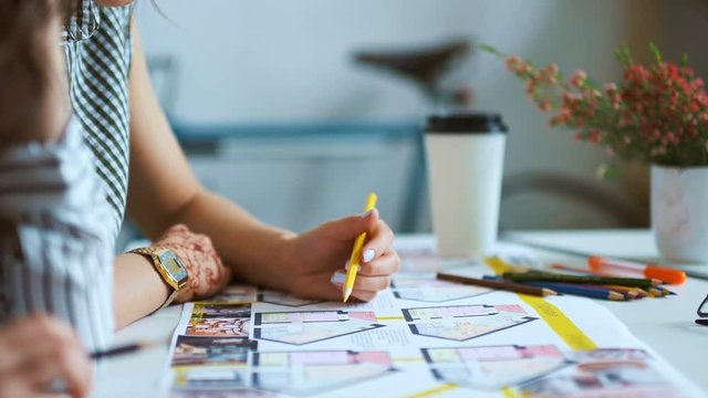 Architect working on blueprint with spesial tools and pencil, close up. female architect at work, only hands with ruler and pencil. Design of the house. Engineer. Tools for drawing. Creating a drawing
