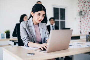 beautiful asian smart woman work with energy and happiness joyful in modern office background