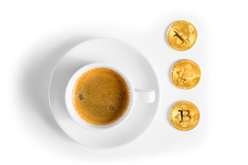 Cryptocurrency golden bitcoin standing on coffee cup isolated on a white background