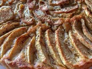 An apple pie. Slised apple with sugar and cinnamon at the top. close up.