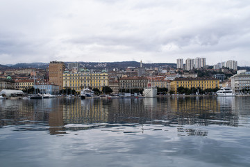 Buildings and boats along the Rijeka water front in Croatia