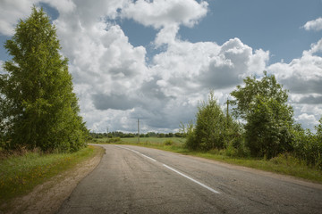 Fototapeta premium panoramic view of hot summer road through the Russian countryside 