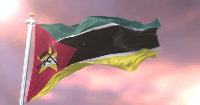 Flag of Mozambique waving at wind in slow at sunset, loop